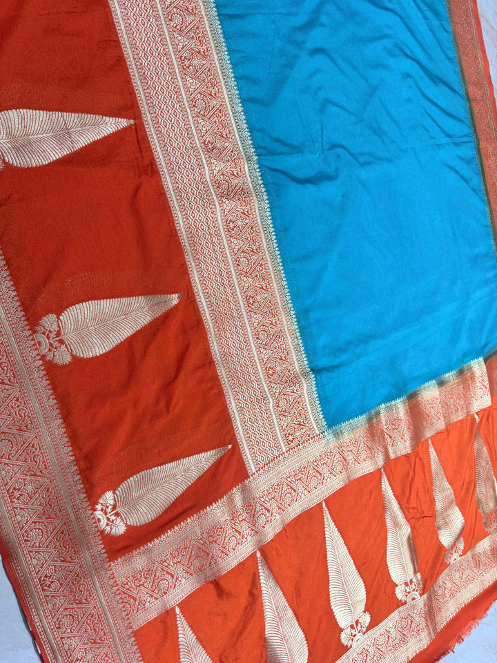 PEACOCK COLOUR KHADDI GEORGETTE WITH KAIRI BOOTA ON ORANGE BORDER