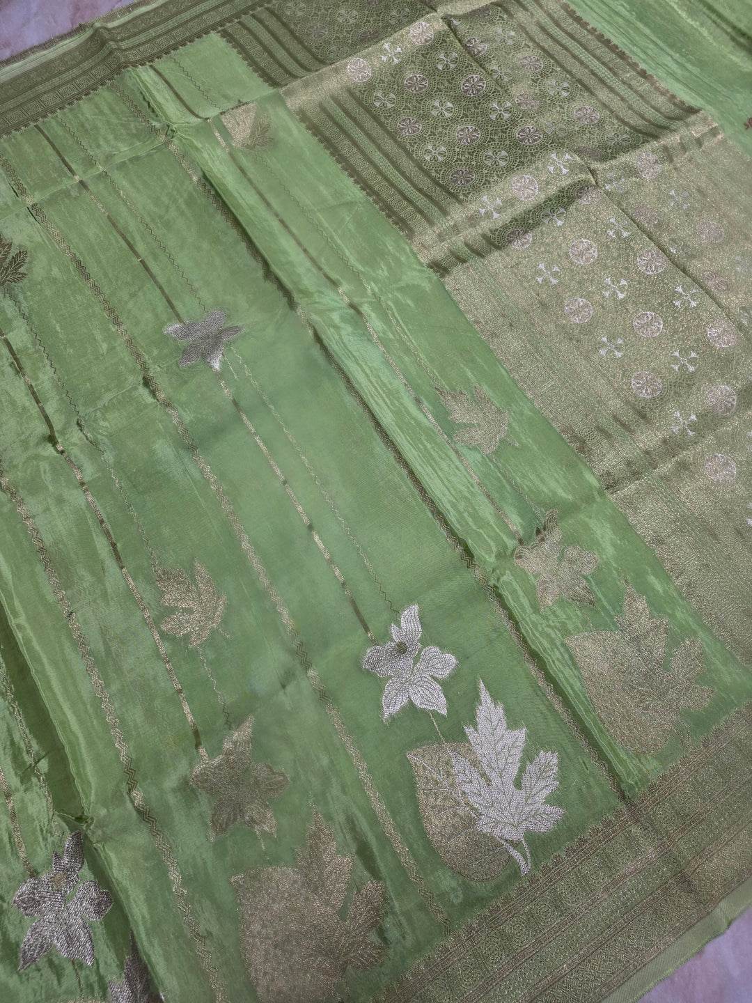 KOREAN SILK IN PISTA GREEN  WITH GOLD AND SILVER ZARI WORK