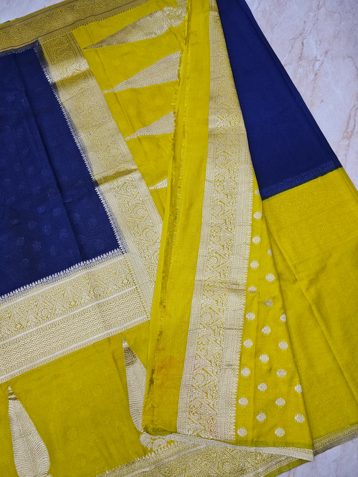 KHADDI GEORGETTE IN NAVY BLUE WITH GOLD BORDER