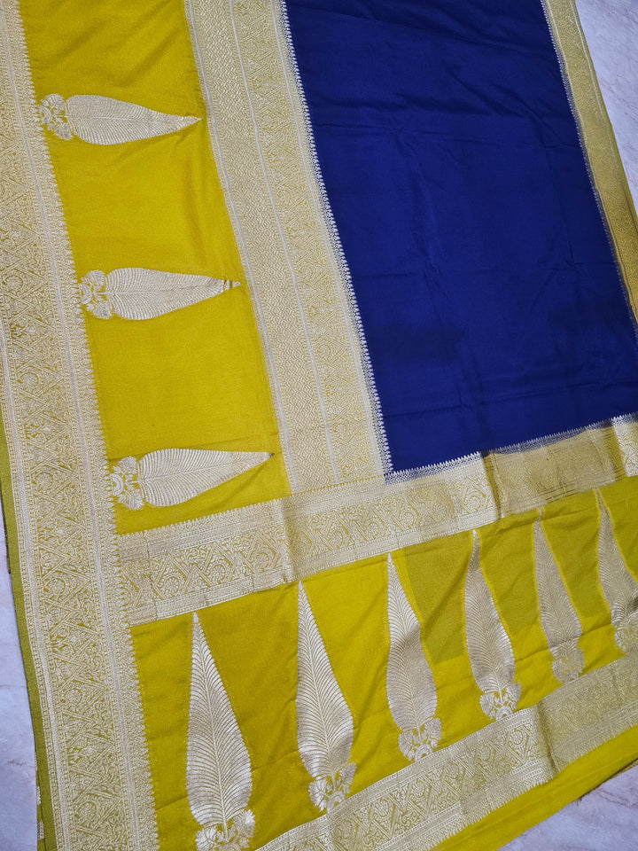 KHADDI GEORGETTE IN NAVY BLUE WITH GOLD BORDER