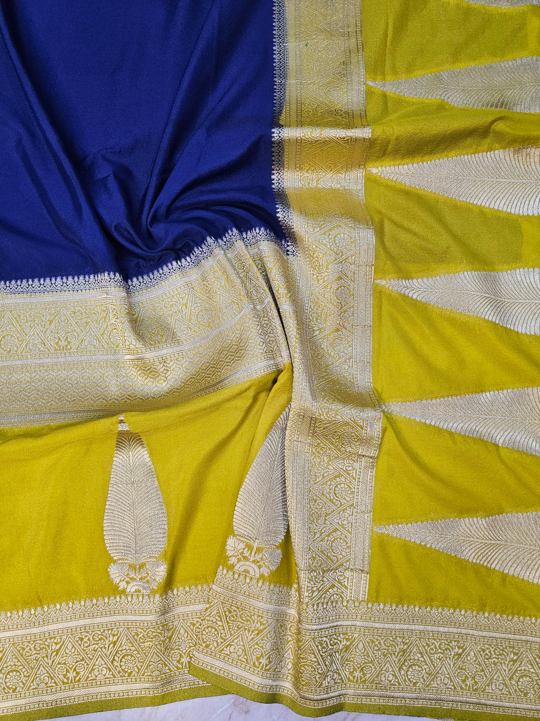 KHADDI GEORGETTE IN NAVY BLUE WITH GOLD BORDER