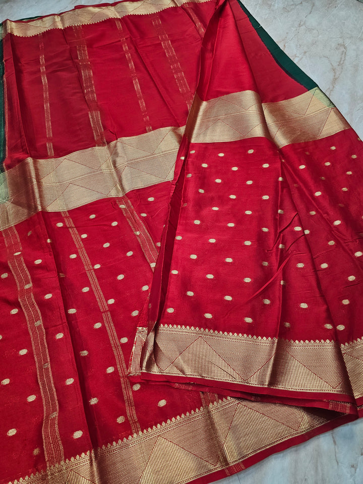MYSORE CREPE IN BOTTLE GREEN WITH RED COLOUR