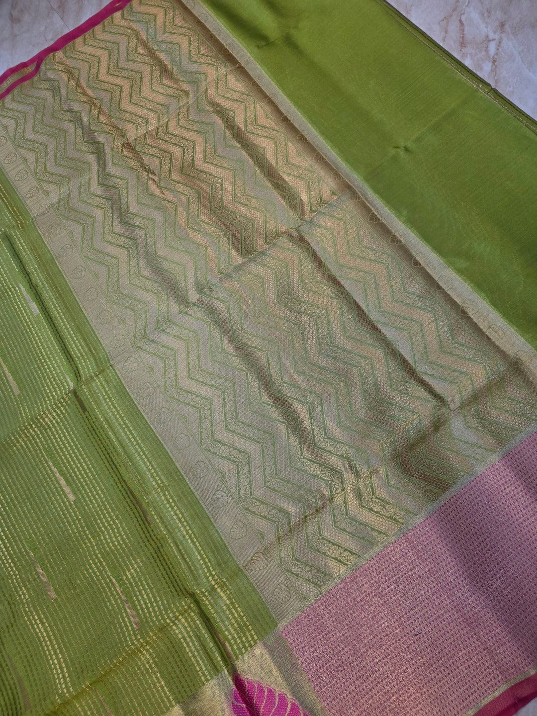 BANARASI SILK IN PARROT GREEN WITH TISU BORDER IN RANI COLOUR