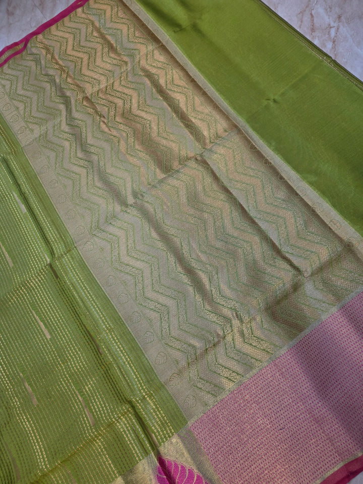 BANARASI SILK IN PARROT GREEN WITH TISU BORDER IN RANI COLOUR