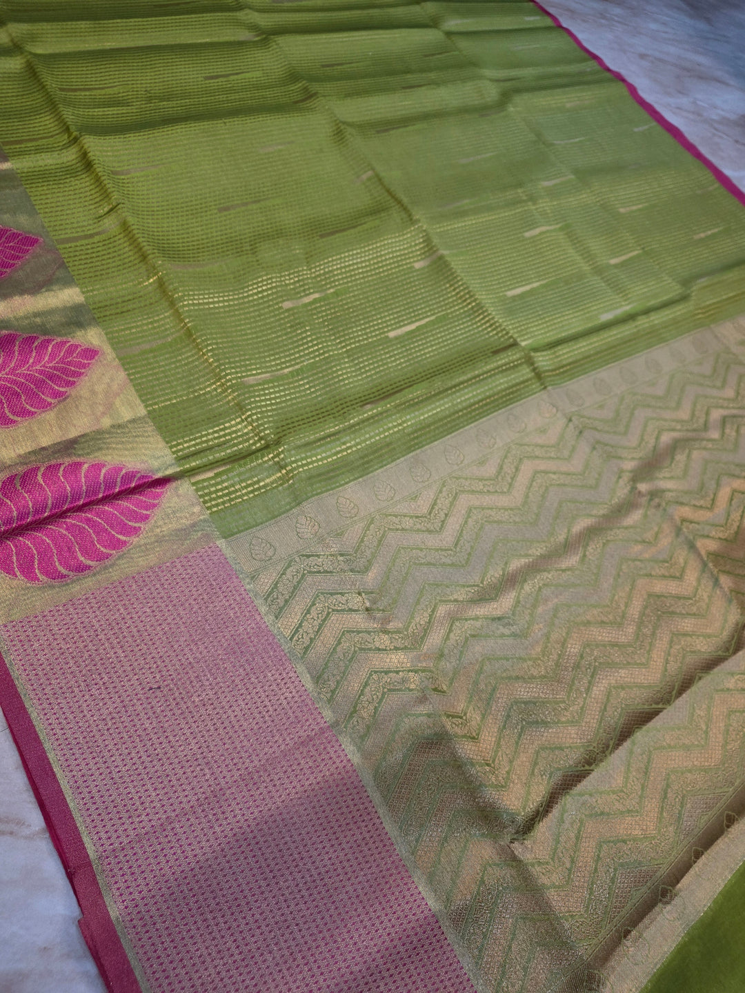BANARASI SILK IN PARROT GREEN WITH TISU BORDER IN RANI COLOUR