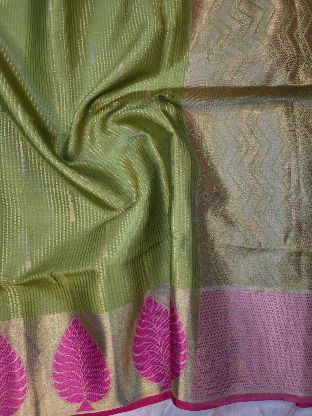BANARASI SILK IN PARROT GREEN WITH TISU BORDER IN RANI COLOUR