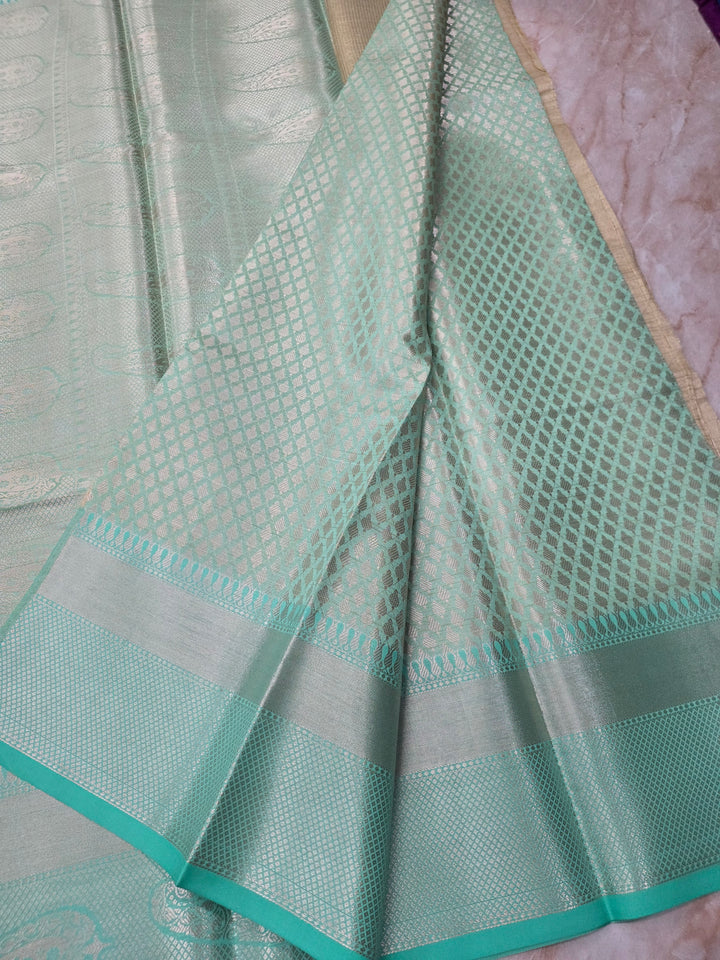 BANARASI TISU SILK IN CREAM WITH SEA GREEN BORDER