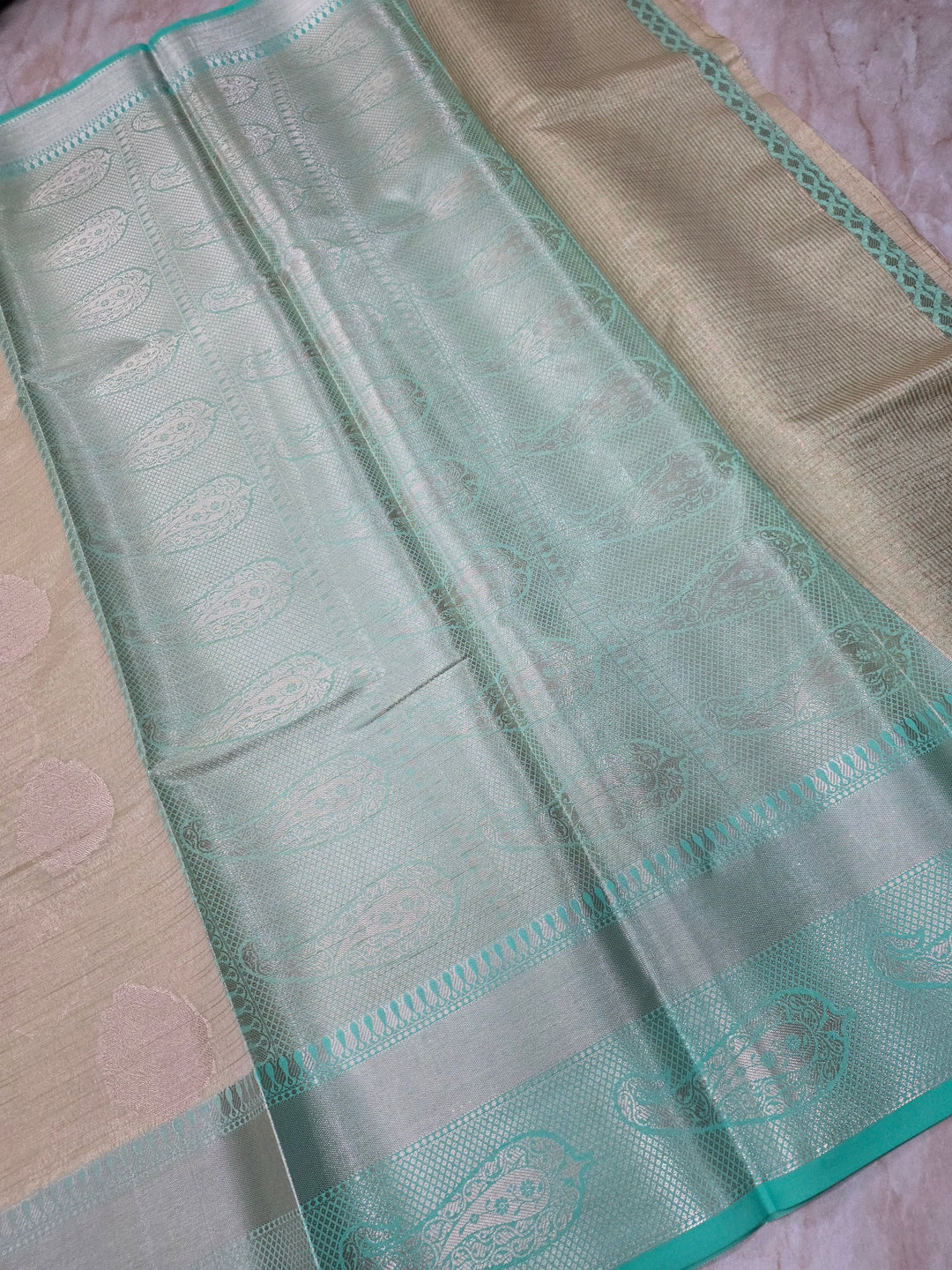 BANARASI TISU SILK IN CREAM WITH SEA GREEN BORDER