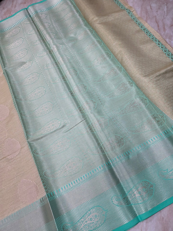 BANARASI TISU SILK IN CREAM WITH SEA GREEN BORDER