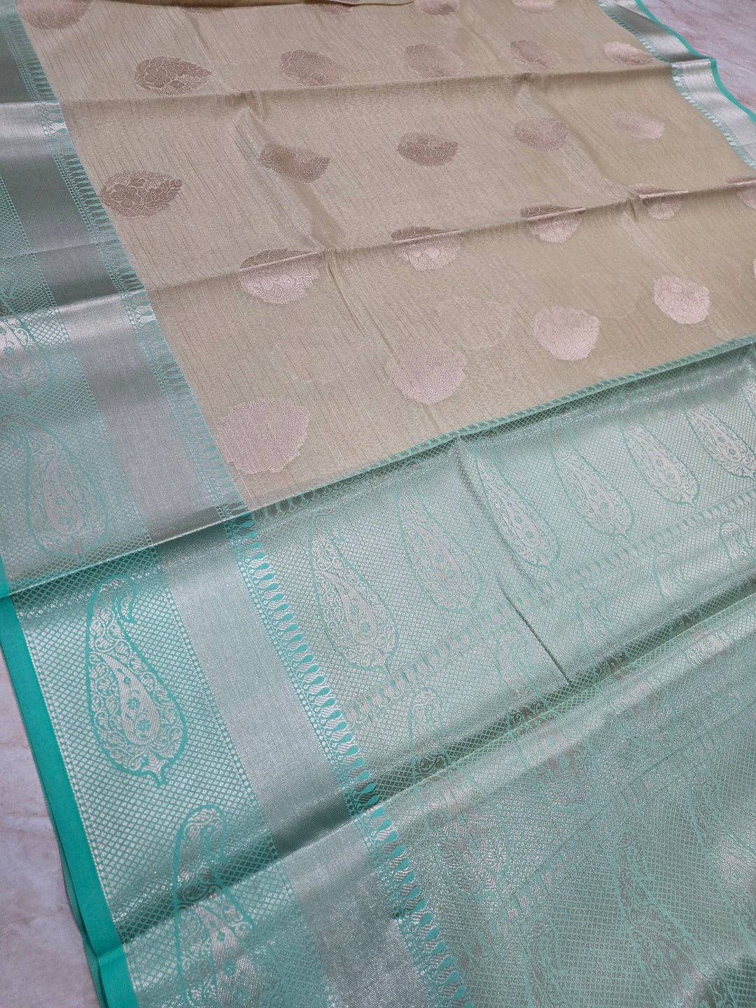 BANARASI TISU SILK IN CREAM WITH SEA GREEN BORDER