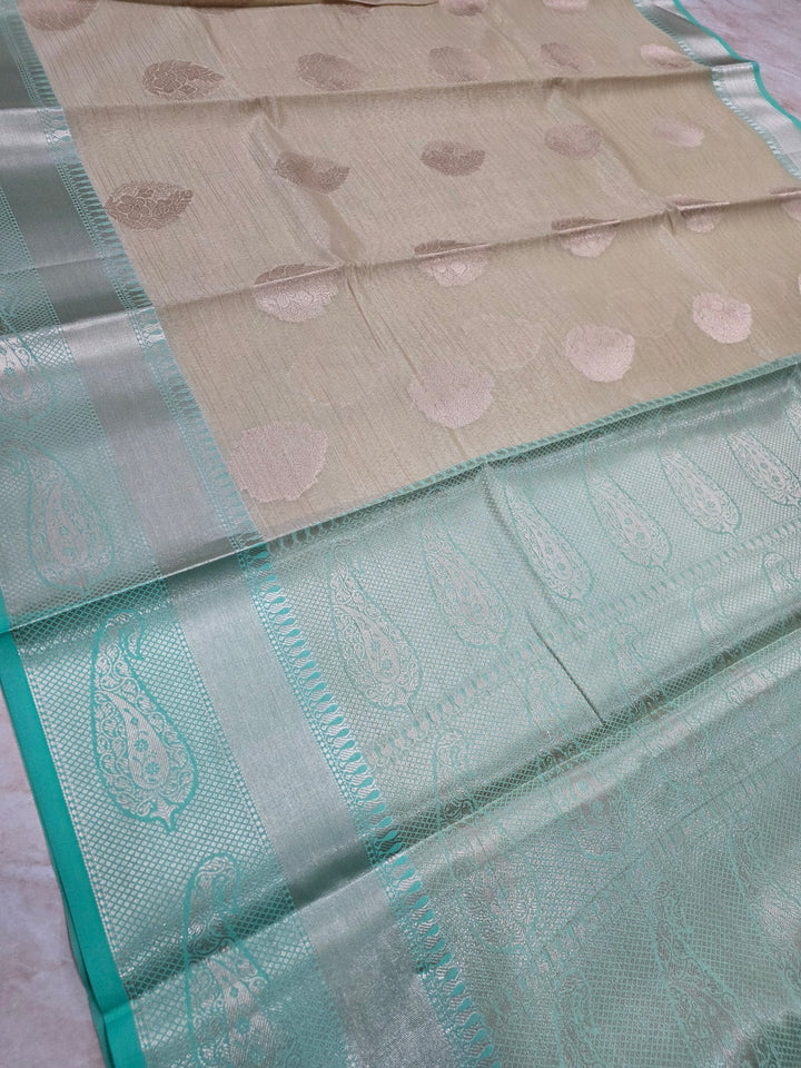 BANARASI TISU SILK IN CREAM WITH SEA GREEN BORDER