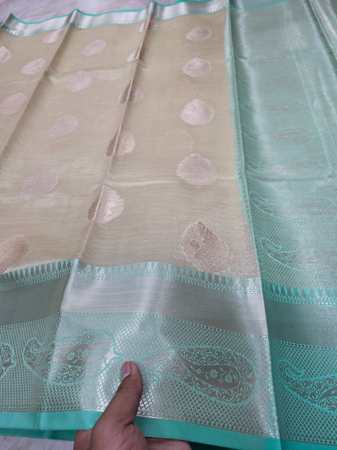 BANARASI TISU SILK IN CREAM WITH SEA GREEN BORDER