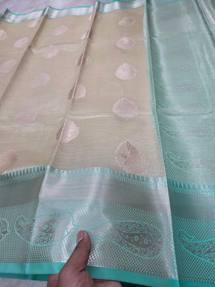 BANARASI TISU SILK IN CREAM WITH SEA GREEN BORDER