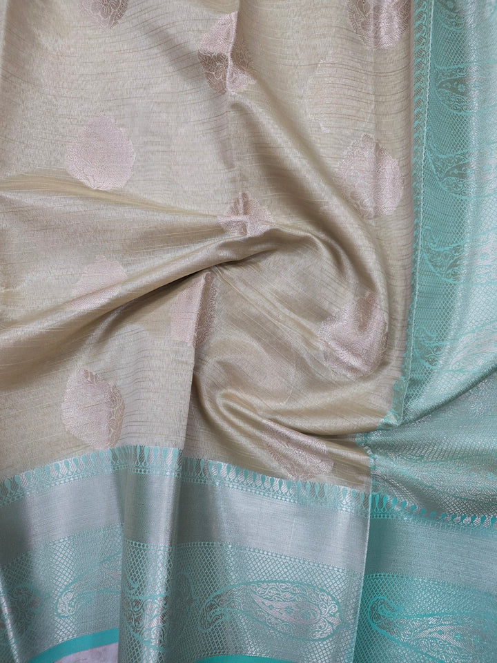BANARASI TISU SILK IN CREAM WITH SEA GREEN BORDER
