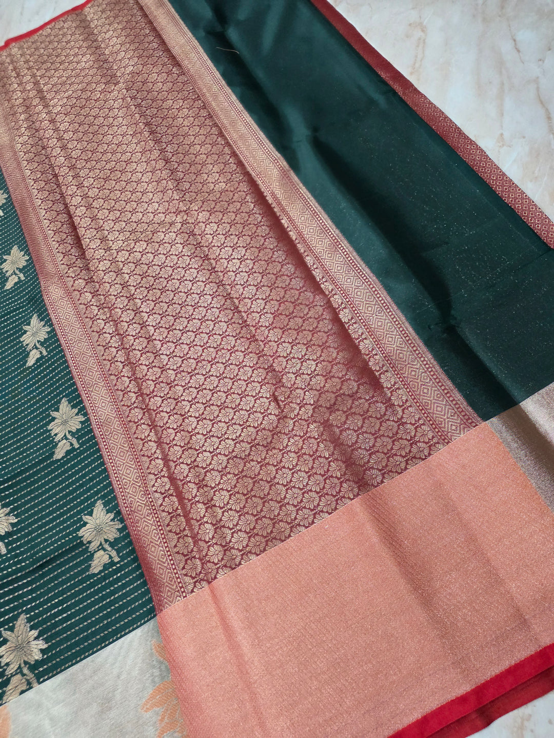BANARASI SILK IN BOTTLE GREEN WITH TISU RED BORDER