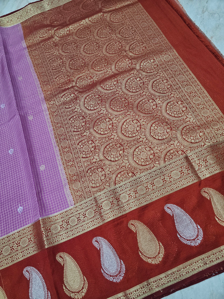 CREPE GEORGETTE IN LAVENDER WITH RED BORDER