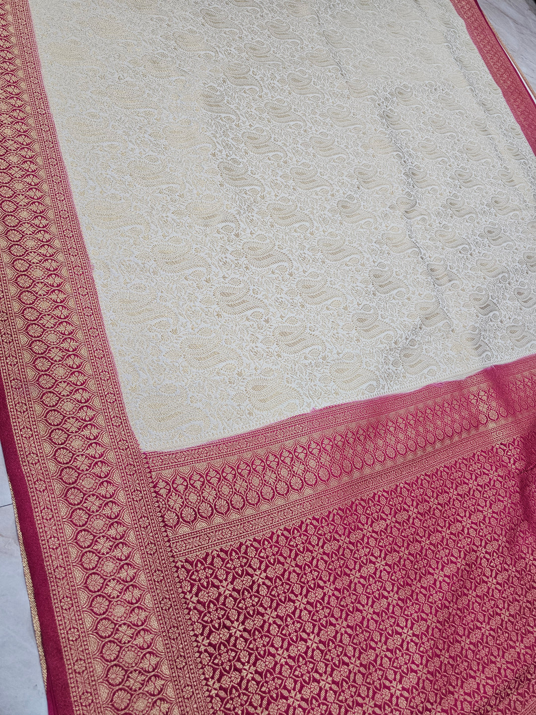 KHADDI GEORGETTE IN CREAM WITH RED BORDER