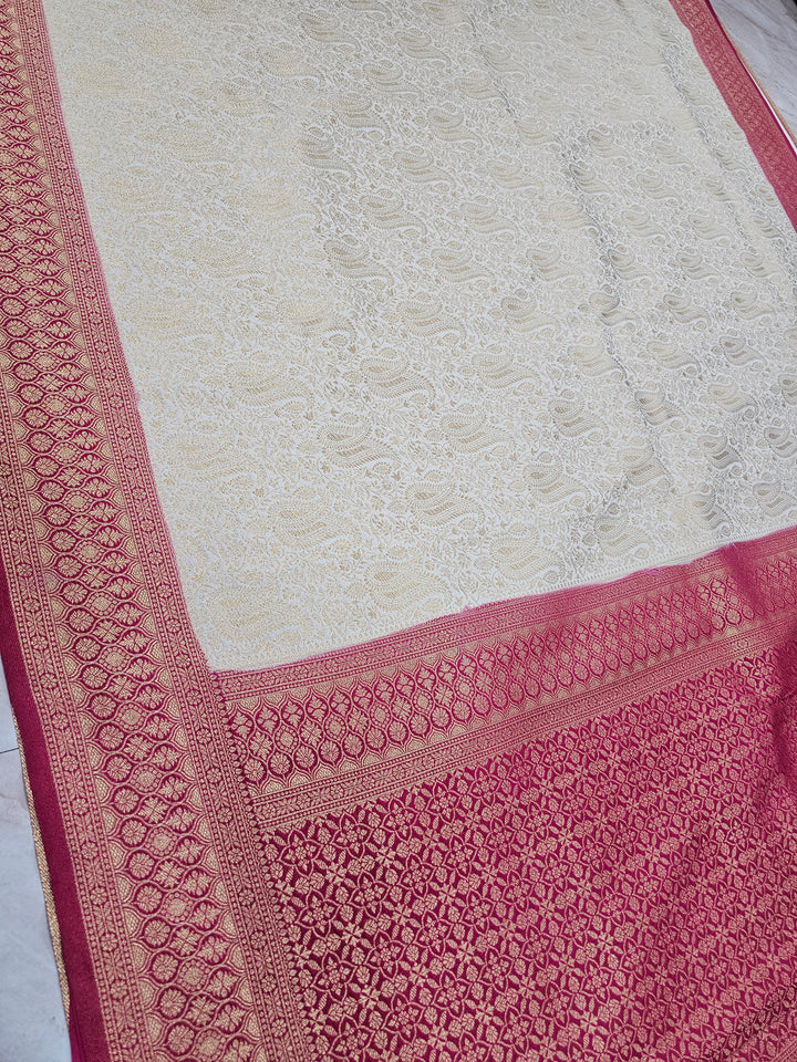 KHADDI GEORGETTE IN CREAM WITH RED BORDER