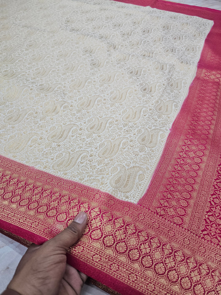 KHADDI GEORGETTE IN CREAM WITH RED BORDER