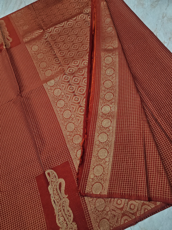 CREPE GEORGETTE IN GOLDEN EMBER WITH GOLD ZARI AND CHECKS