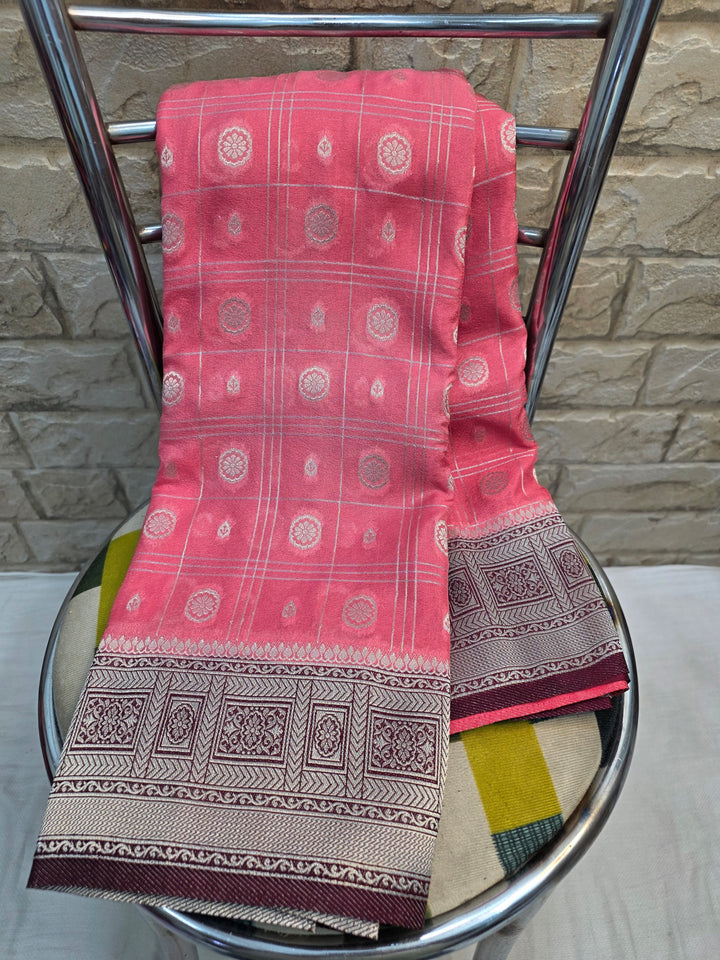 CREPE GEORGETTE IN PASTEL PEACH WITH COFFE BORDER