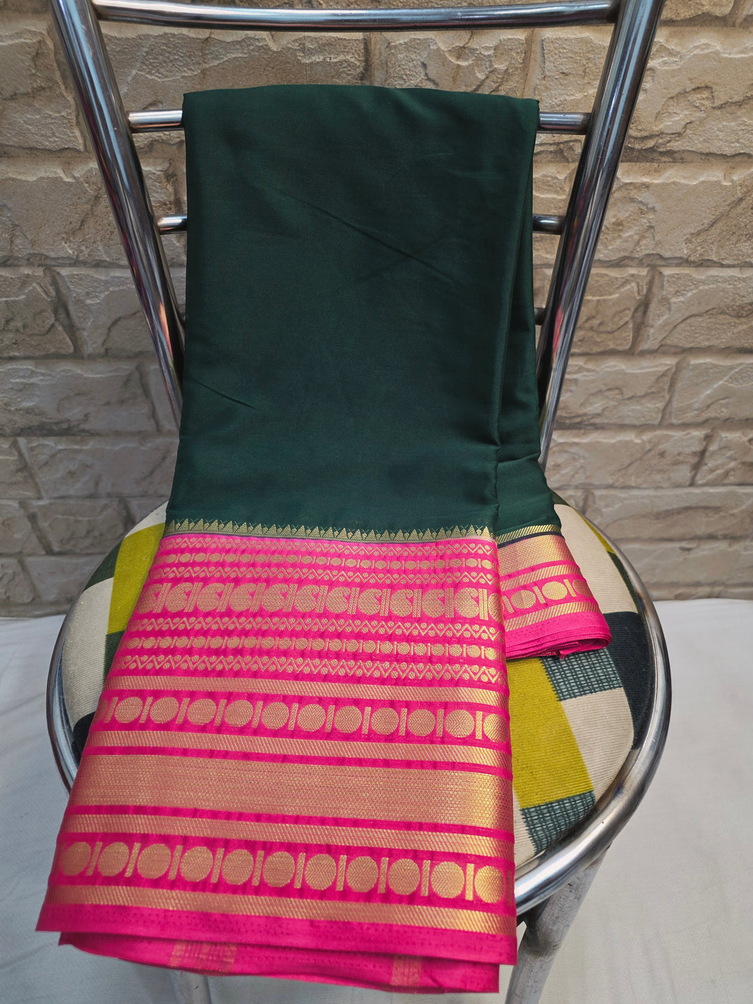 CREPE GEORGETTE IN BOTTLE GREEN WITH RANI BORDER