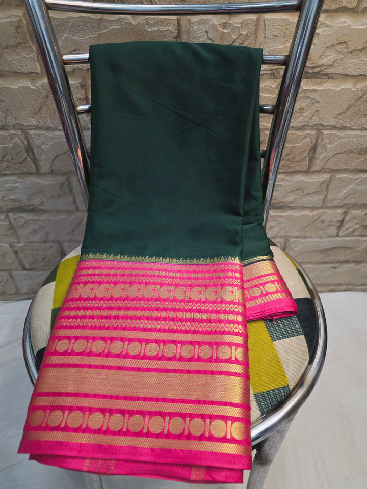 CREPE GEORGETTE IN BOTTLE GREEN WITH RANI BORDER
