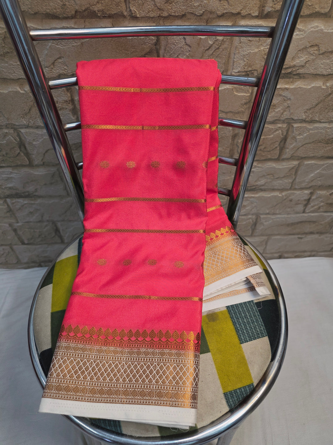 CREPE GEORGETTE IN PEACH WITH CREAM BORDER