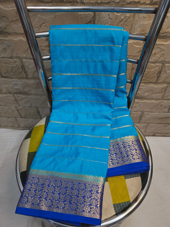 CREPE  GEORGETTE IN OCEAN BLUE WITH ROYAL BLUE  BORDER