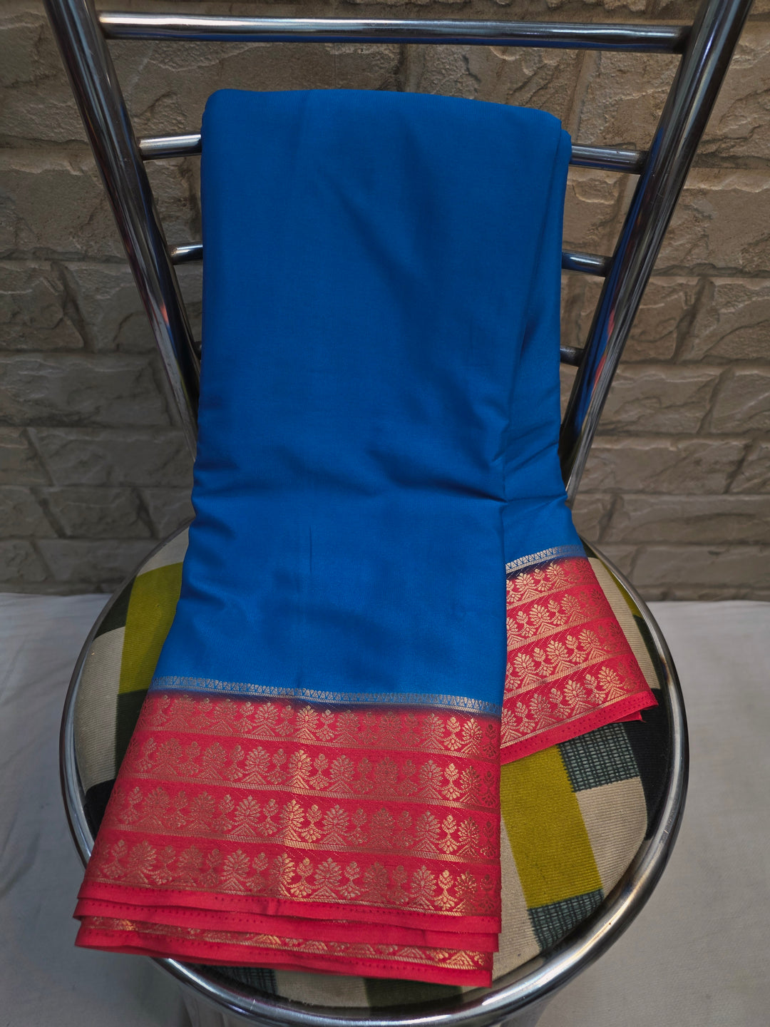 CREPE GEORGETTE IN ROYAL BLUE WITH PEACH  BORDER