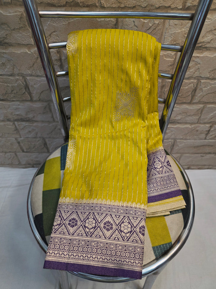 GEORGETTE SAREE IN GOLD WITH  PURPLE BORDER