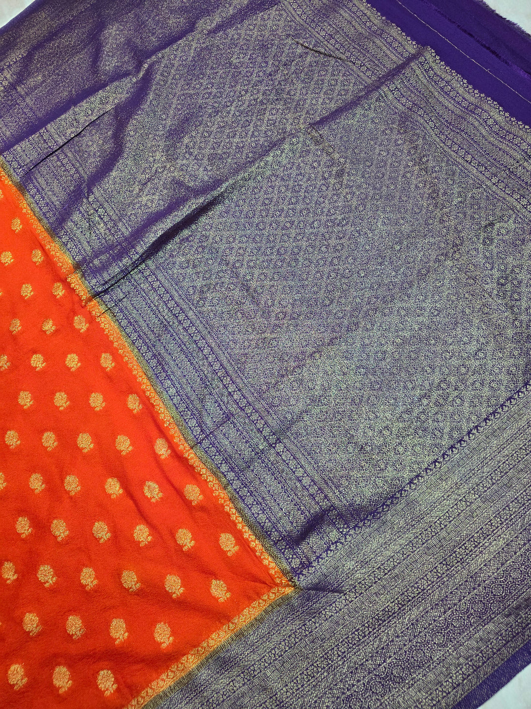 KHADDI GEORGETTE IN TANGY ORANGE WITH VIOLET BORDER