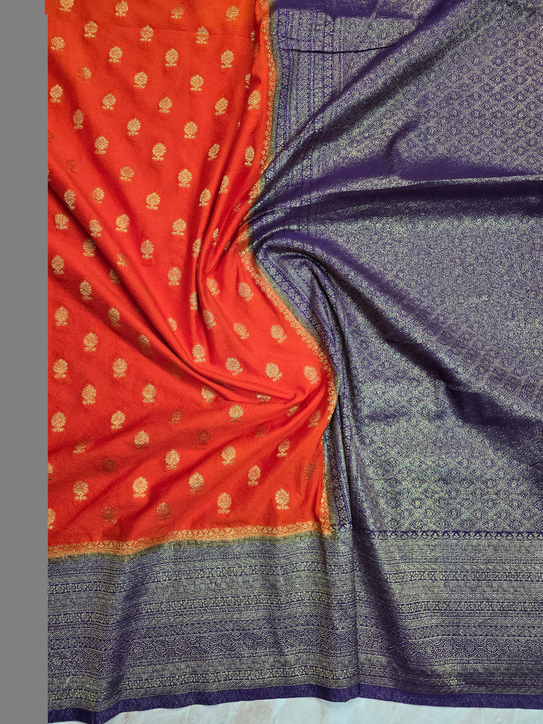 KHADDI GEORGETTE IN TANGY ORANGE WITH VIOLET BORDER