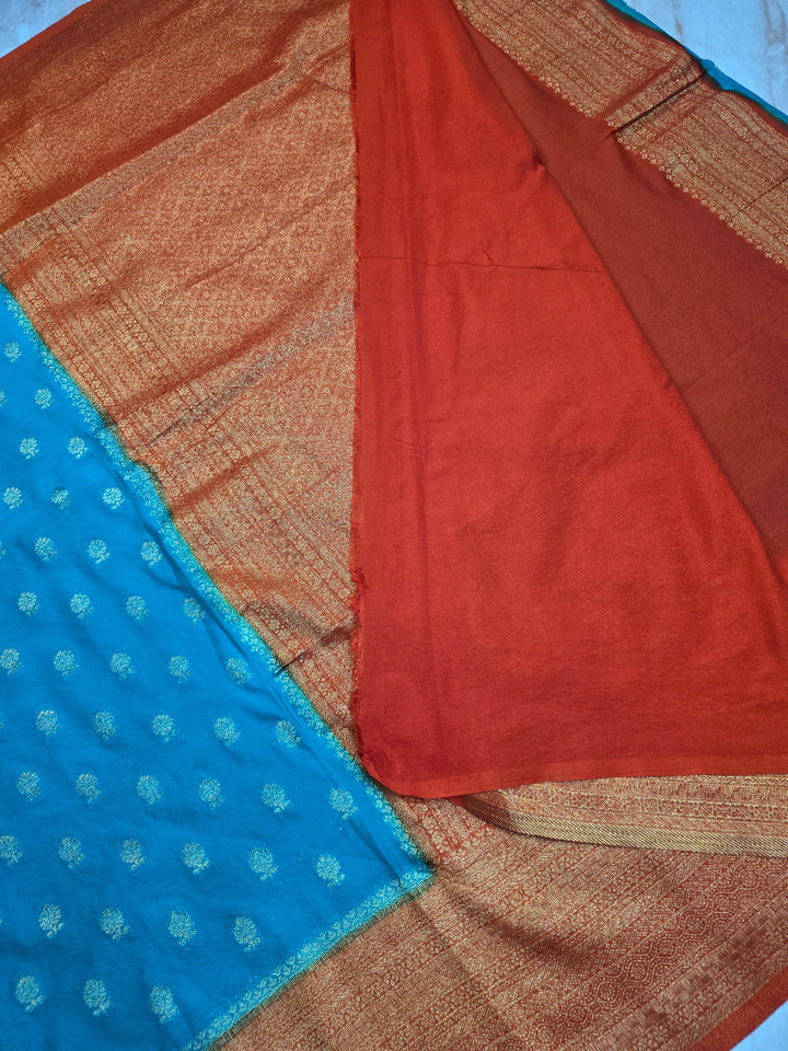 KHADDI GEROGETTE IN TORQUOISE BLUE WITH ORANGE BORDER