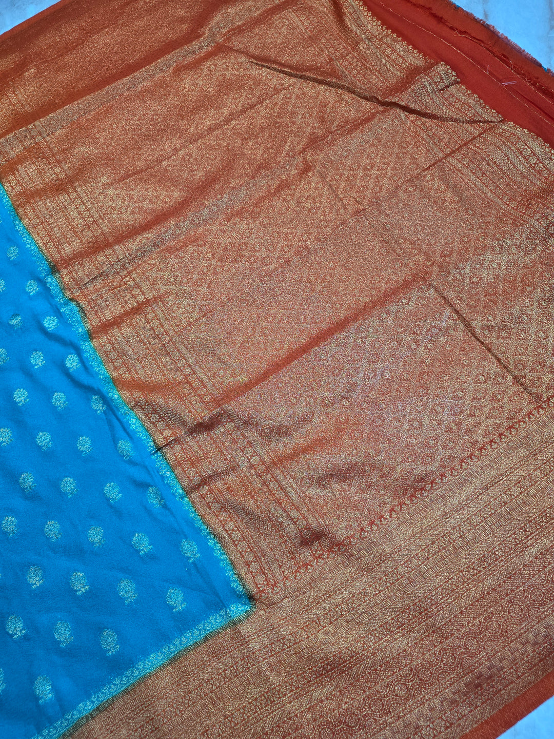 KHADDI GEROGETTE IN TORQUOISE BLUE WITH ORANGE BORDER
