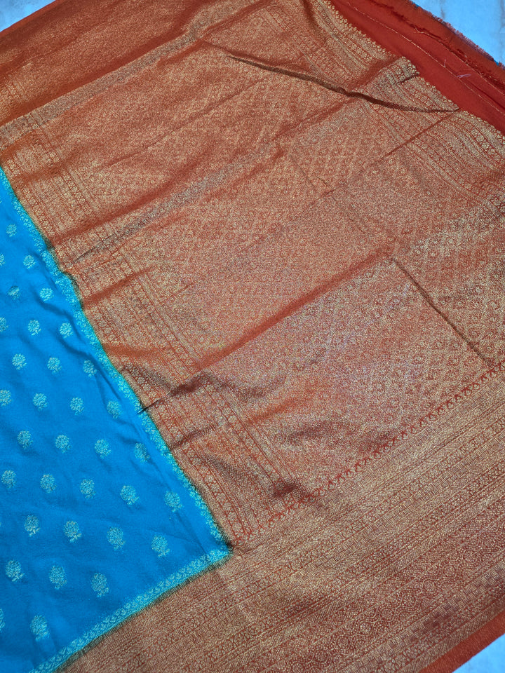 KHADDI GEROGETTE IN TORQUOISE BLUE WITH ORANGE BORDER