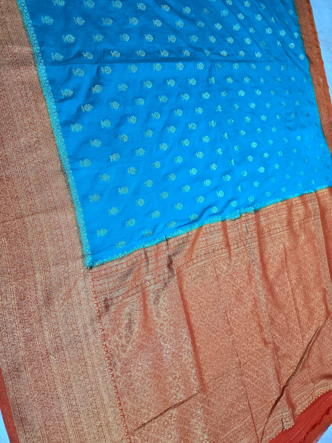 KHADDI GEROGETTE IN TORQUOISE BLUE WITH ORANGE BORDER