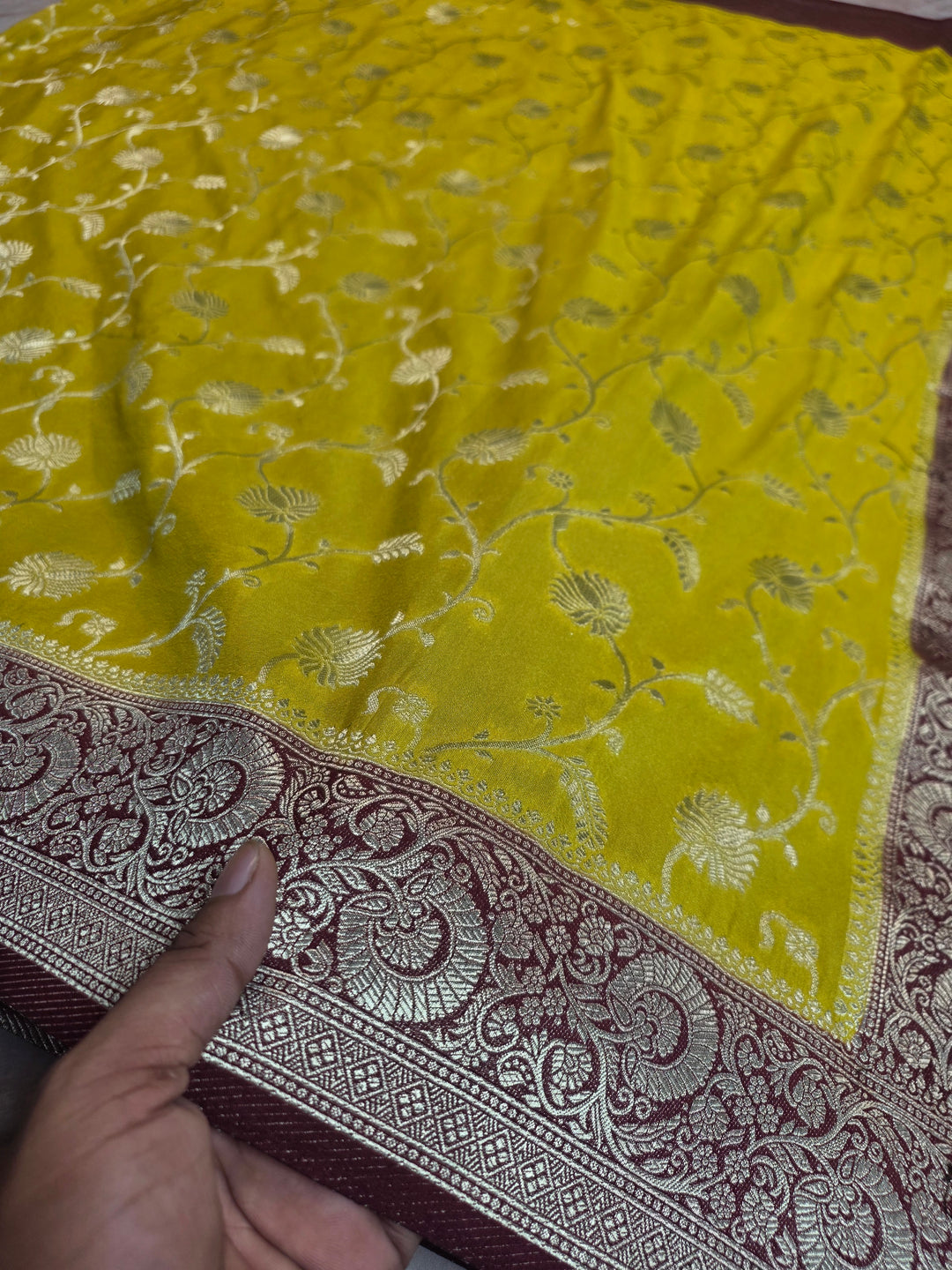 KHADDI GEORGETTE IN YELLOW LIME WITH GARNET BORDER