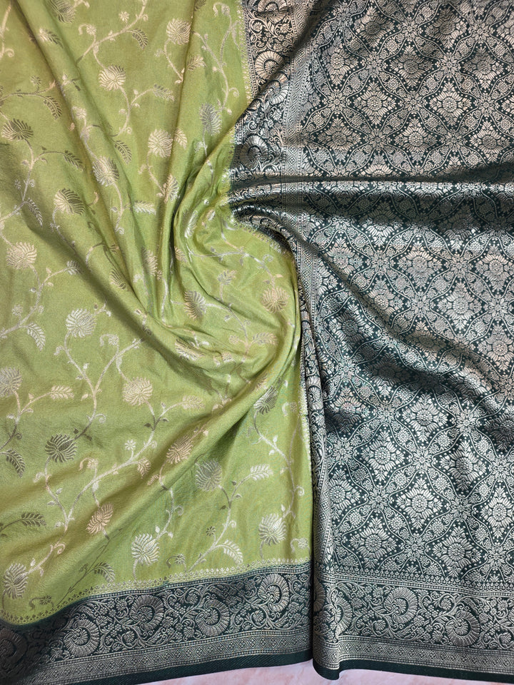 KHADDI GEORGETTE IN PISTA GREEN WITH BOTTLE GREEN BORDER