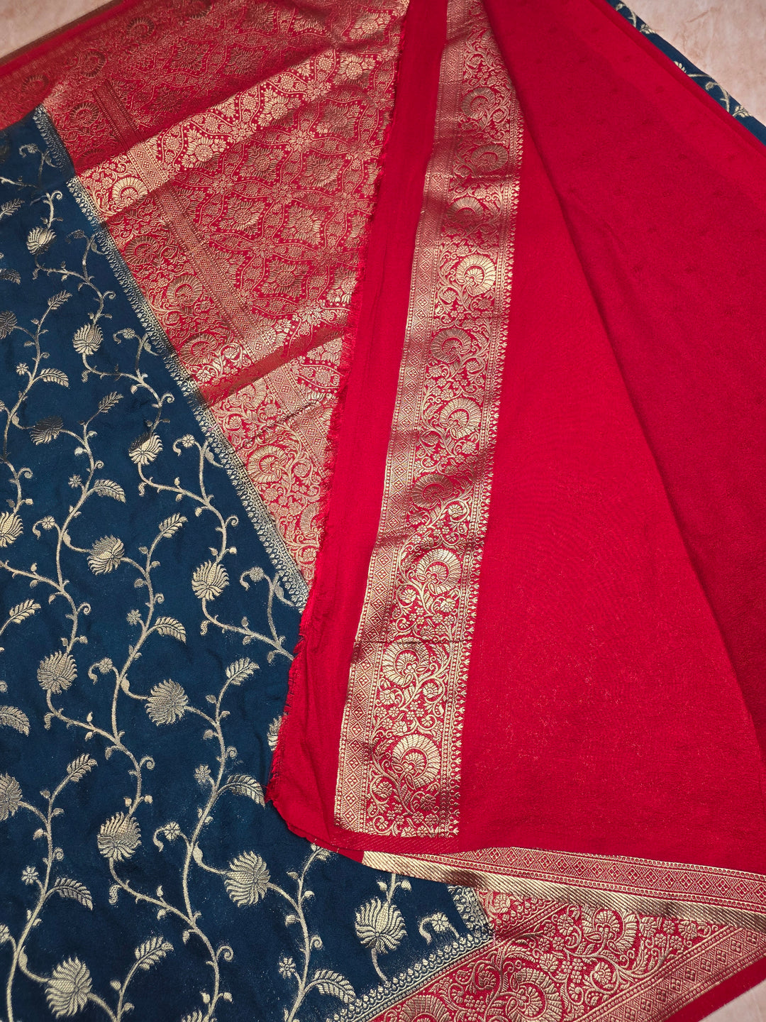 KHADDI GEORGETTE IN DARK BLUE WITH RED BORDER