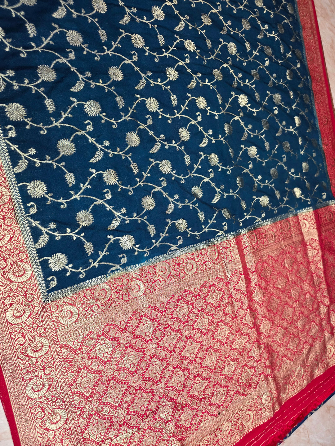 KHADDI GEORGETTE IN DARK BLUE WITH RED BORDER