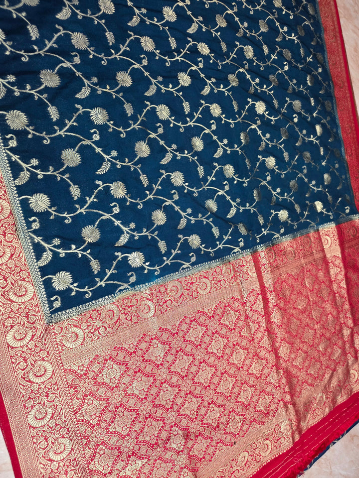 KHADDI GEORGETTE IN DARK BLUE WITH RED BORDER