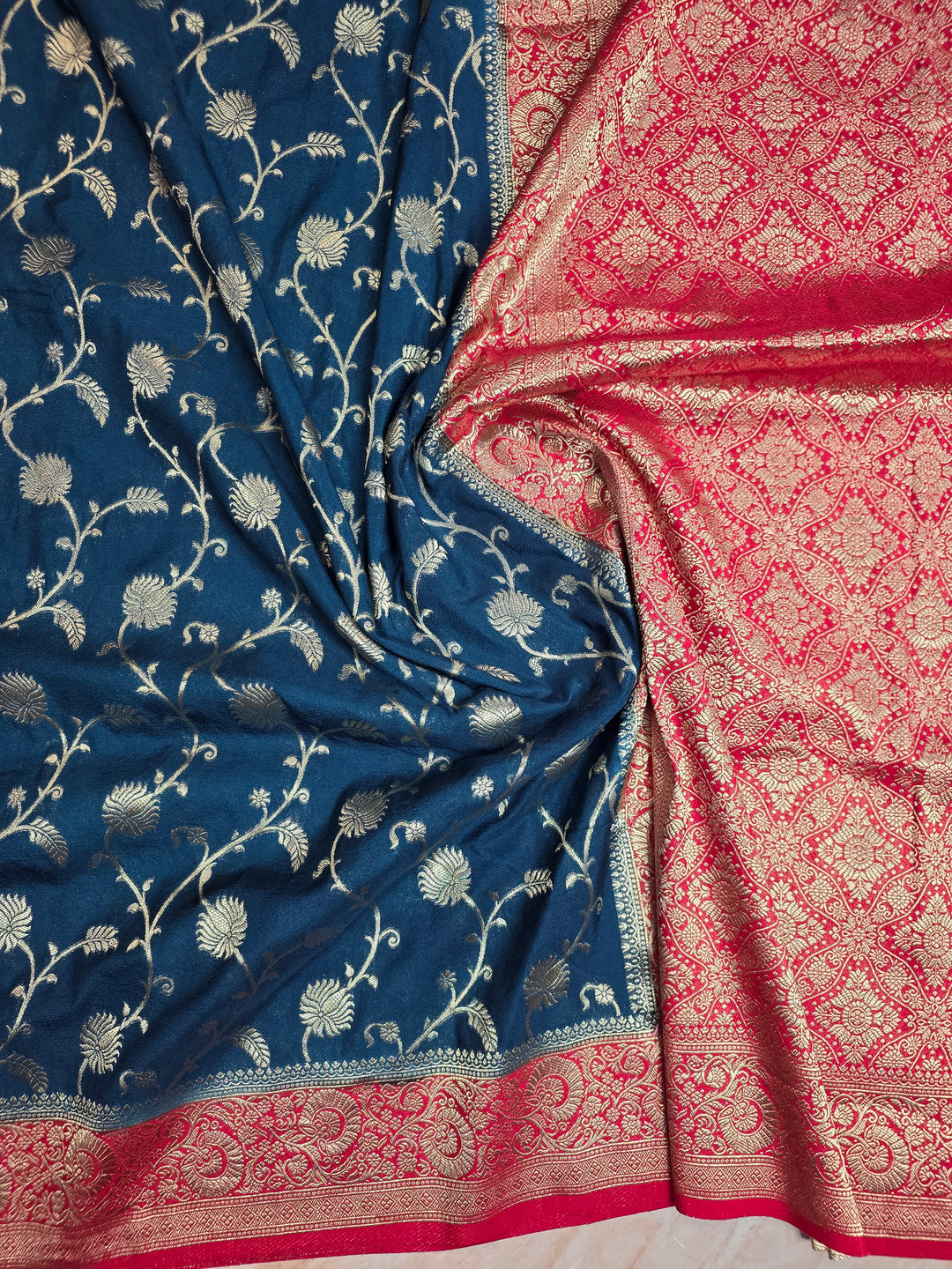 KHADDI GEORGETTE IN DARK BLUE WITH RED BORDER