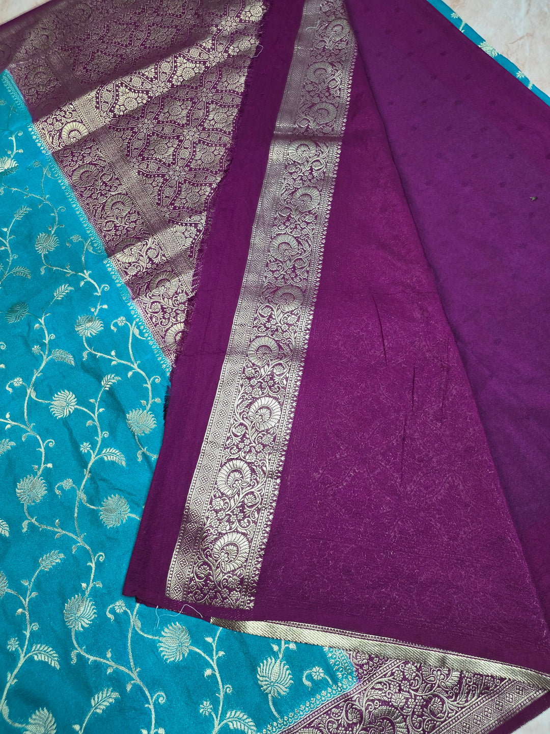 KHADDI GEORGETTE IN FEROZI BLUE WITH MAGENTA BORDER
