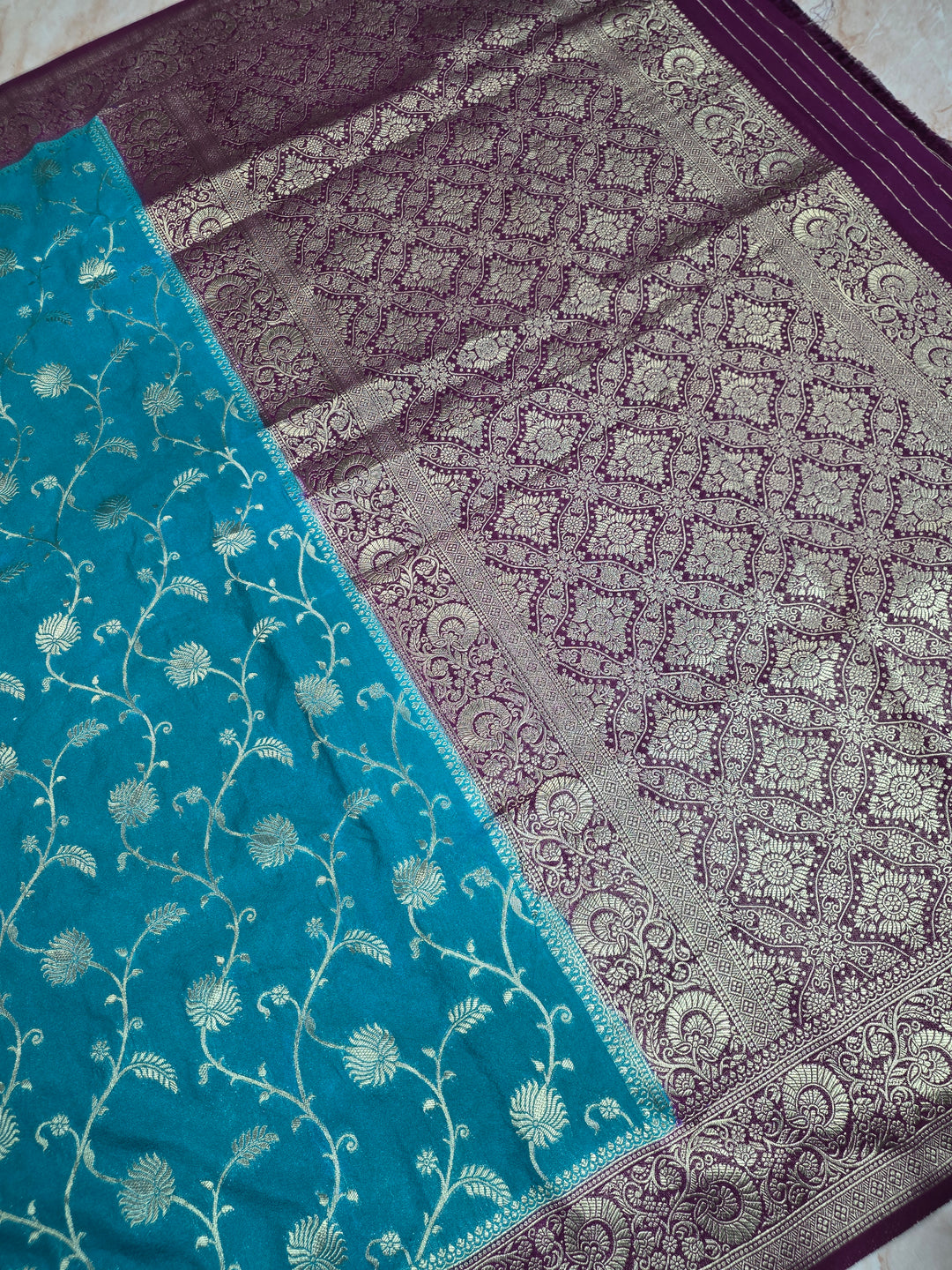 KHADDI GEORGETTE IN FEROZI BLUE WITH MAGENTA BORDER