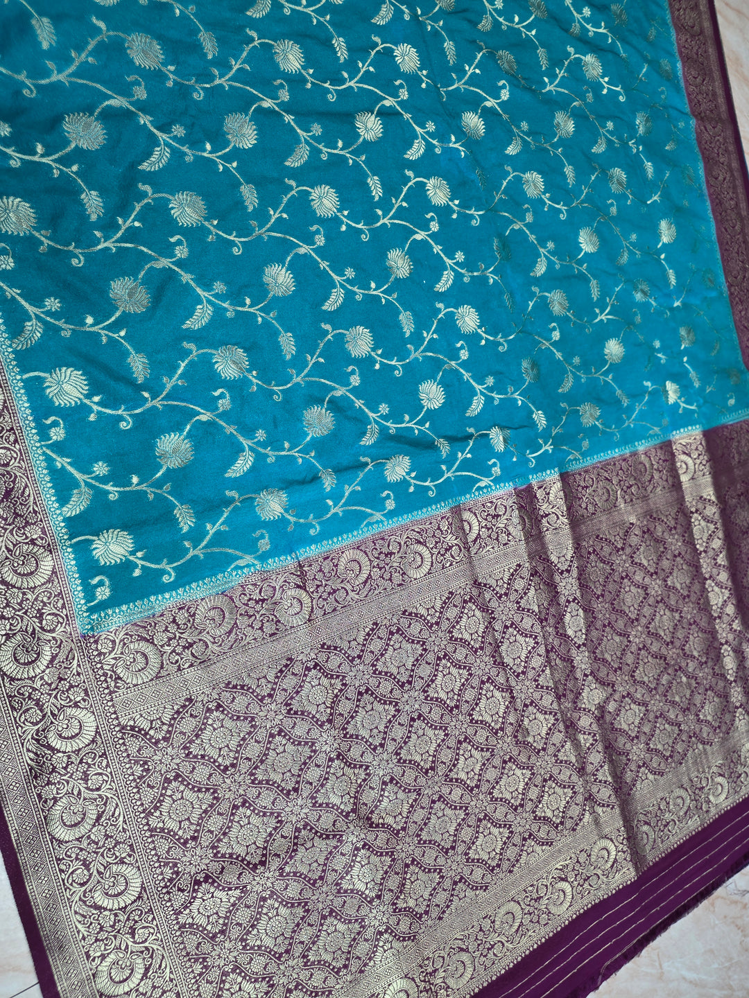KHADDI GEORGETTE IN FEROZI BLUE WITH MAGENTA BORDER