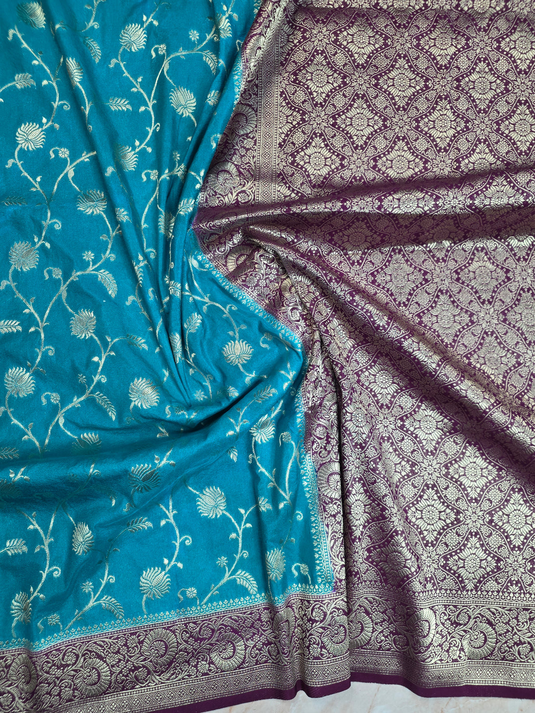 KHADDI GEORGETTE IN FEROZI BLUE WITH MAGENTA BORDER