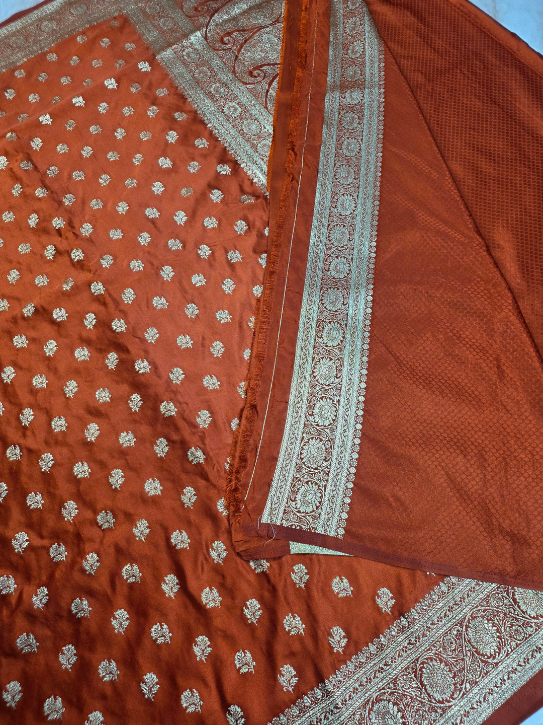 MASHRU KATAN SILK IN RUST ORANGE WITH GOLD ZARIWORK