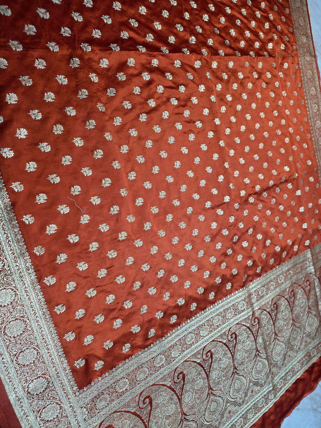 MASHRU KATAN SILK IN RUST ORANGE WITH GOLD ZARIWORK