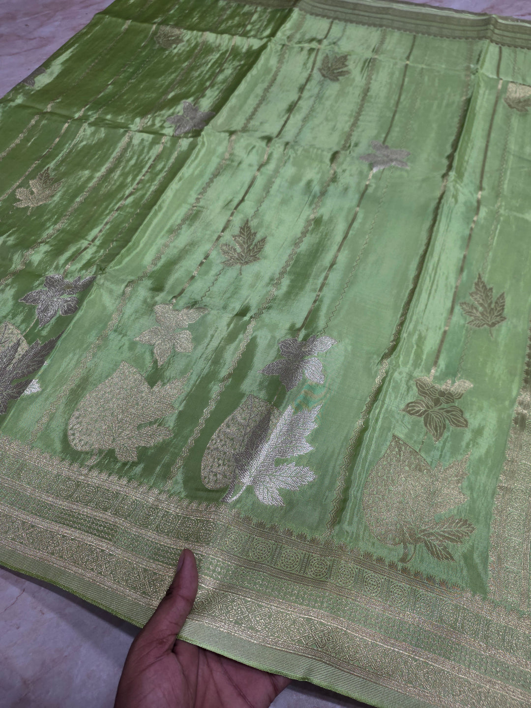 KOREAN SILK IN PISTA GREEN  WITH GOLD AND SILVER ZARI WORK